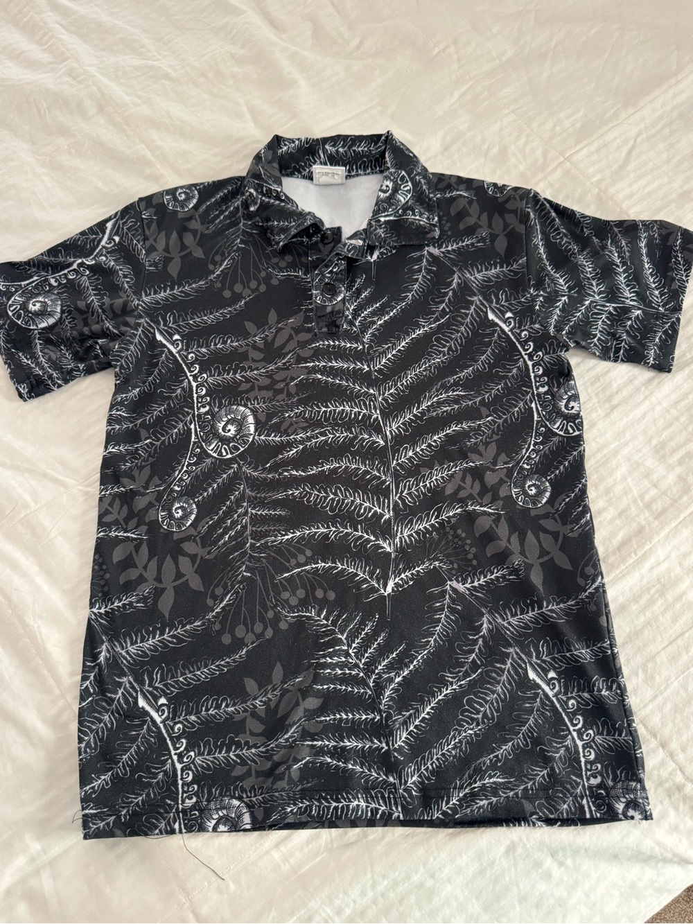 Men's Black Fern-Print Polo Shirt with Subtle Scroll Detail